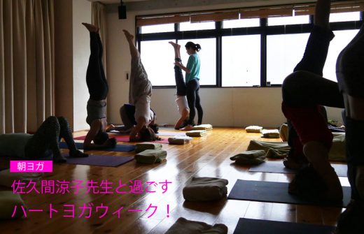 逆光の中ヘッドスタンドしている生徒さん