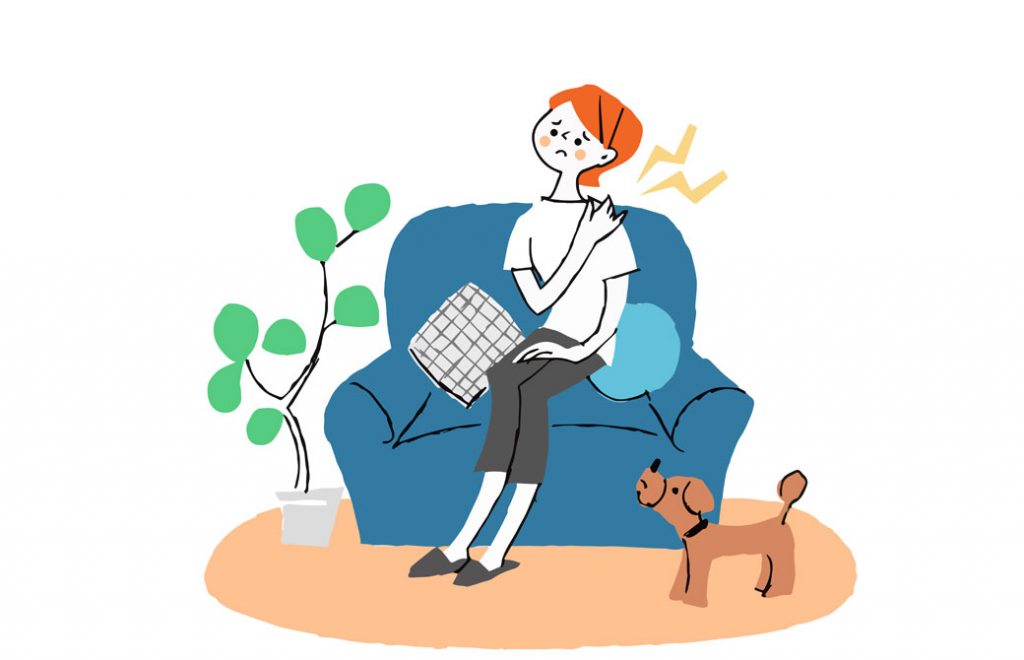 痛そうな表情で肩を押さえる女性と傍らにいる犬のイラスト