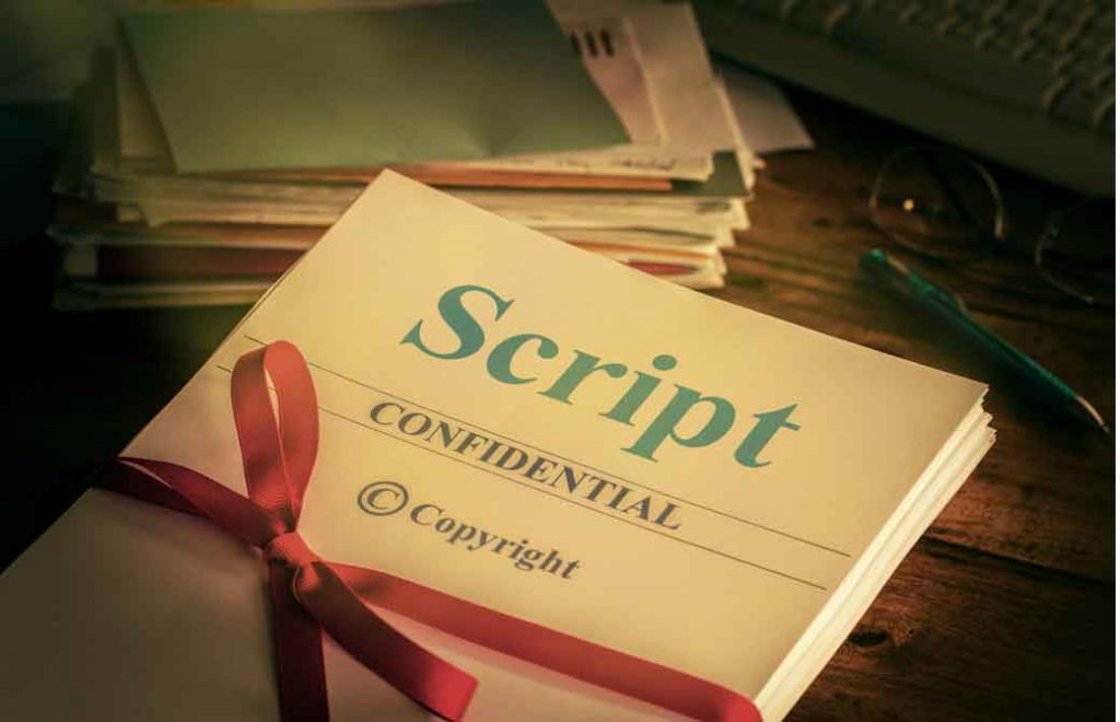 Scriptと書いた本にリボンがかかっている
